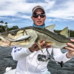 An angler holding a great snook caught in Homosassa