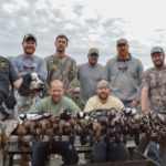 a group of duck hunters with harvested ducks in Homosassa